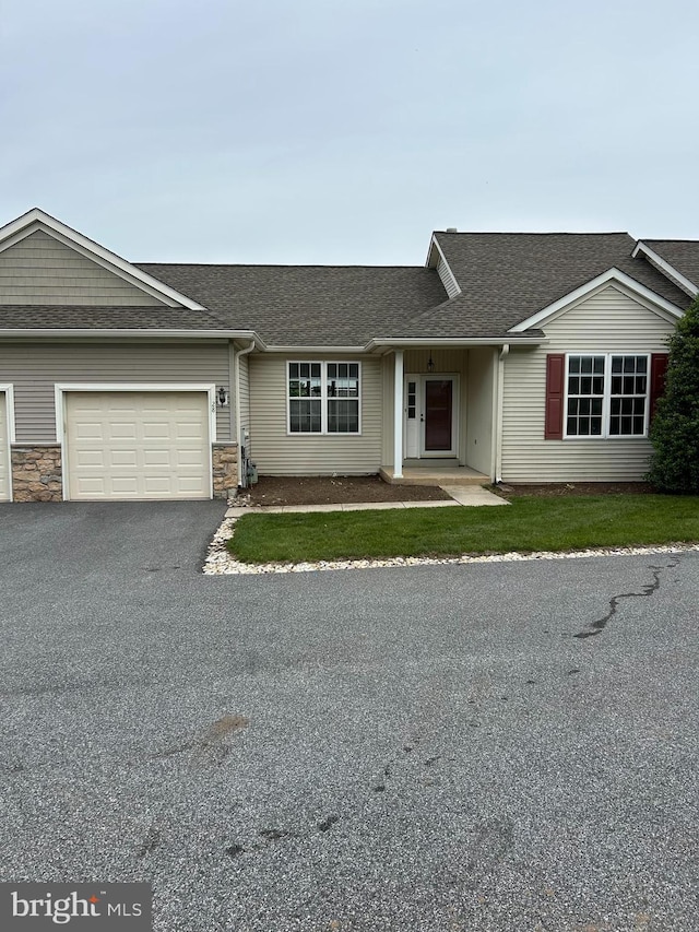 28 W Houndpack Way, Glen Mills, PA 19342 - view of front of house featuring a garage, a shingled roof, and asphalt driveway