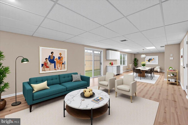 28 W Houndpack Way, Glen Mills, PA 19342 - living area featuring a paneled ceiling, light wood-type flooring, and baseboards