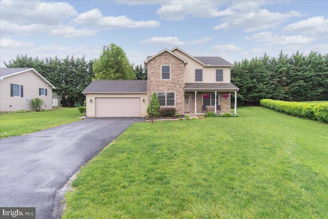 192 Antietam Dr, Waynesboro, PA 17268 - traditional-style house with stone siding, asphalt driveway, an attached garage, a porch, and a front yard