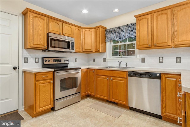 192 Antietam Dr, Waynesboro, PA 17268 - kitchen with appliances with stainless steel finishes, a sink, tasteful backsplash, light countertops, and recessed lighting