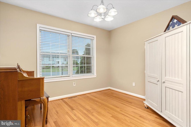 192 Antietam Dr, Waynesboro, PA 17268 - unfurnished bedroom with a chandelier, light wood-style floors, and baseboards