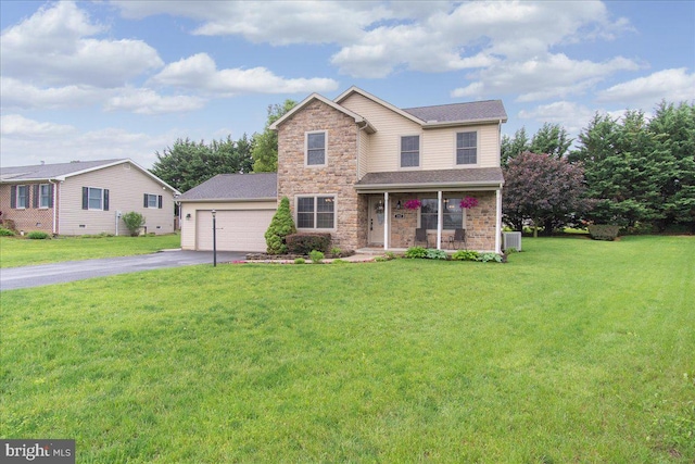 192 Antietam Dr, Waynesboro, PA 17268 - traditional home with driveway, a front lawn, a garage, covered porch, and stone siding