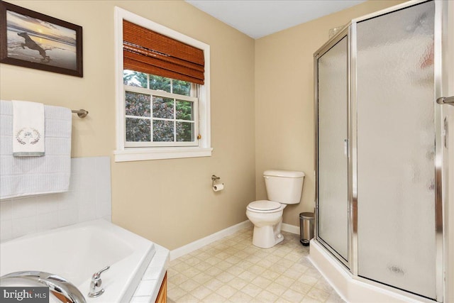 192 Antietam Dr, Waynesboro, PA 17268 - bathroom with baseboards, toilet, a stall shower, and a garden tub