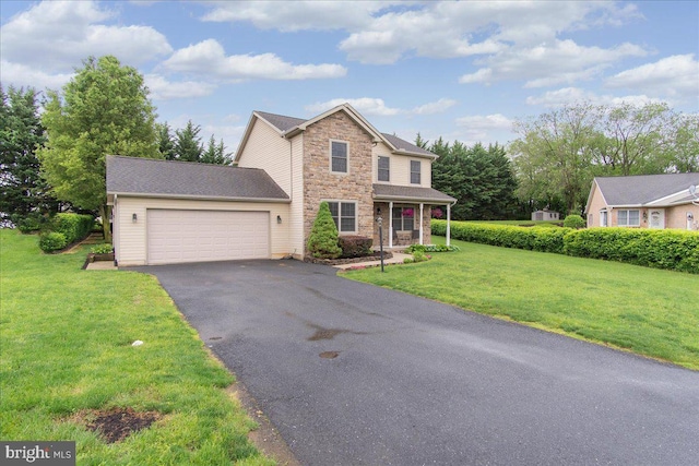 192 Antietam Dr, Waynesboro, PA 17268 - traditional-style house with stone siding, a garage, asphalt driveway, and a front yard