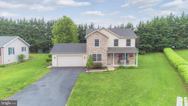 192 Antietam Dr, Waynesboro, PA 17268 - traditional home featuring stone siding, a porch, asphalt driveway, a garage, and a front yard