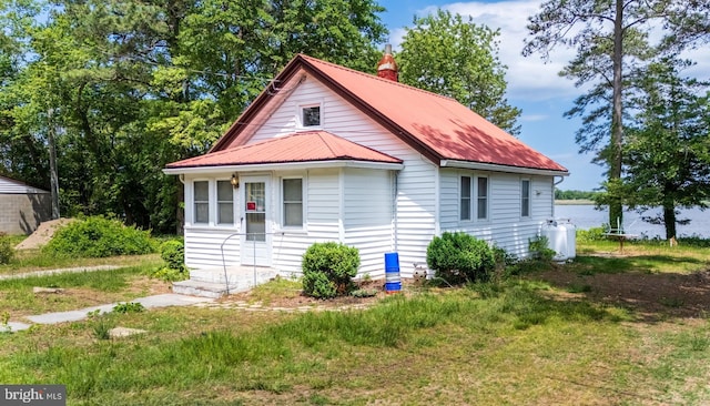 27992 Possum Point Rd, Millsboro, DE 19966 - view of side of home with a chimney and metal roof