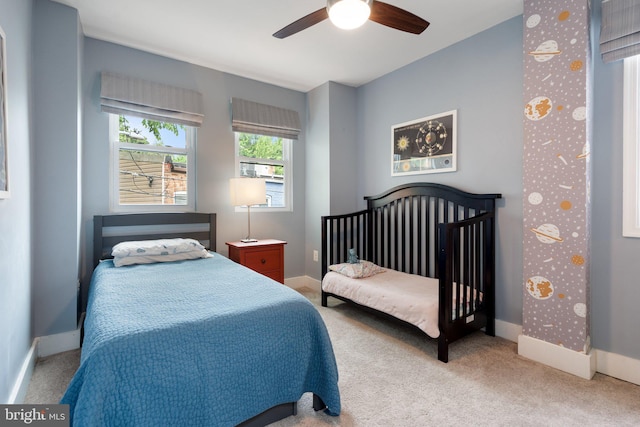 bedroom with carpet, baseboards, and ceiling fan