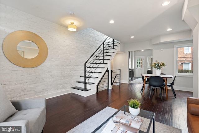 living room featuring stairs, wood finished floors, recessed lighting, and baseboards