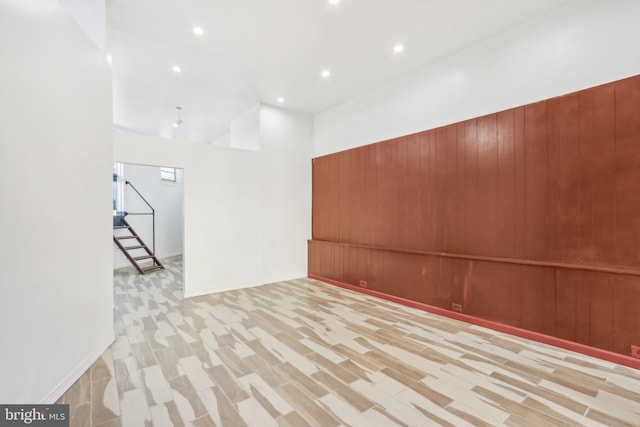 702 Main St, Darby, PA 19023 - empty room featuring wood walls and recessed lighting