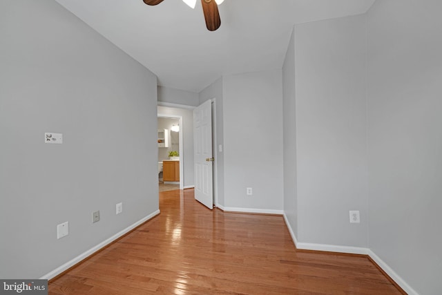 5948 Edgehill Ct, Alexandria, VA 22303 - unfurnished room featuring a ceiling fan, light wood-style floors, and baseboards
