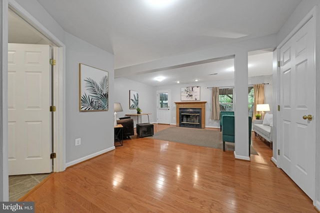 5948 Edgehill Ct, Alexandria, VA 22303 - living room with wood finished floors, a fireplace with flush hearth, and baseboards