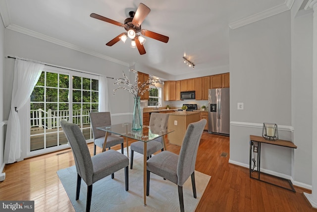 5948 Edgehill Ct, Alexandria, VA 22303 - dining area with a ceiling fan, track lighting, ornamental molding, light wood-type flooring, and baseboards