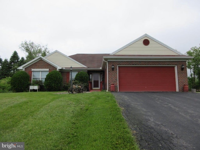 155 Wagon Wheel Ln, Mifflintown, PA 17059 - ranch-style home with asphalt driveway, a front lawn, an attached garage, and brick siding