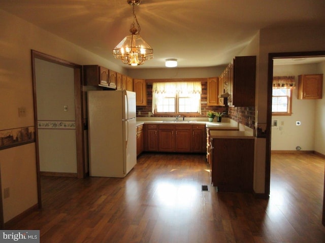 155 Wagon Wheel Ln, Mifflintown, PA 17059 - kitchen with freestanding refrigerator, a chandelier, a sink, and light countertops