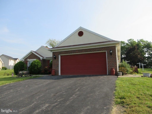 155 Wagon Wheel Ln, Mifflintown, PA 17059 - view of front facade with brick siding, asphalt driveway, and a front yard