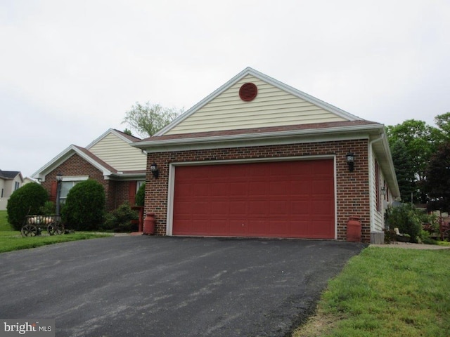 155 Wagon Wheel Ln, Mifflintown, PA 17059 - view of front of home with brick siding, driveway, and an attached garage