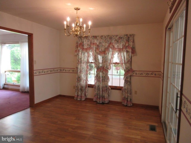 155 Wagon Wheel Ln, Mifflintown, PA 17059 - spare room with wood finished floors, a chandelier, and baseboards