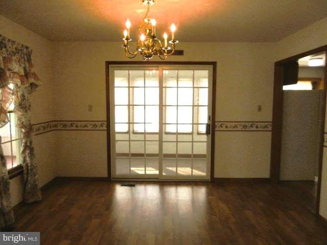 155 Wagon Wheel Ln, Mifflintown, PA 17059 - unfurnished dining area featuring a chandelier, wood finished floors, and wainscoting
