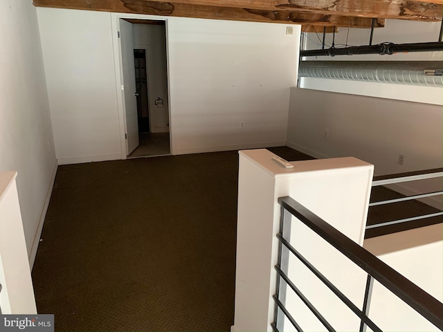 staircase with baseboards and carpet