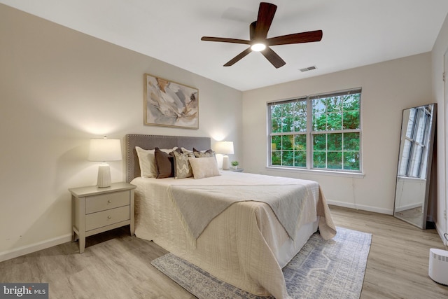 21850 Goldstone Ter, Sterling, VA 20164 - bedroom with light wood-style flooring, baseboards, and ceiling fan