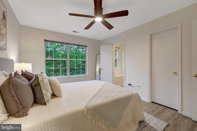 21850 Goldstone Ter, Sterling, VA 20164 - bedroom with light wood-style floors, ceiling fan, baseboards, and connected bathroom