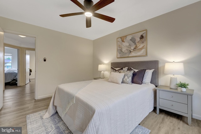 21850 Goldstone Ter, Sterling, VA 20164 - bedroom with light wood-style floors, baseboards, and ceiling fan