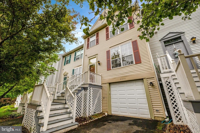 21850 Goldstone Ter, Sterling, VA 20164 - view of front of property with stairs, a garage, and driveway