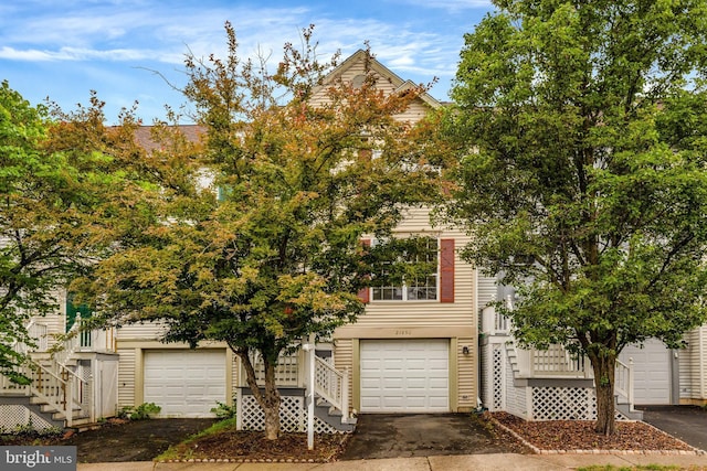 21850 Goldstone Ter, Sterling, VA 20164 - obstructed view of property featuring stairs and asphalt driveway