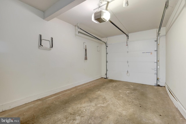 21850 Goldstone Ter, Sterling, VA 20164 - garage with a garage door opener and a baseboard radiator