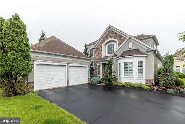267 Goldenrod Dr, Upper Gwynedd, PA 19446 - view of front facade featuring a standing seam roof, driveway, a shingled roof, and metal roof