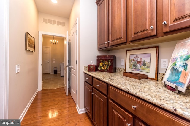 267 Goldenrod Dr, Upper Gwynedd, PA 19446 - corridor with a chandelier, light wood-style flooring, and baseboards