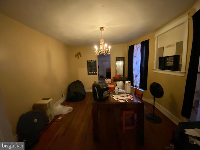 5336 Race St, Philadelphia, PA 19139 - dining area with a chandelier, wood finished floors, and baseboards