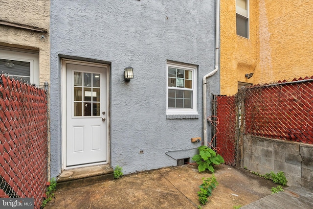 1611 N Cadwallader St, Philadelphia, PA 19122 - property entrance with stucco siding