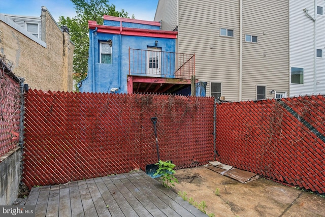 1611 N Cadwallader St, Philadelphia, PA 19122 - rear view of house featuring a fenced backyard and a deck