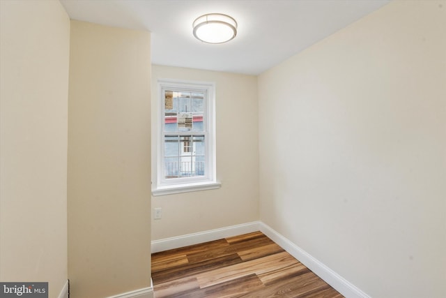 1611 N Cadwallader St, Philadelphia, PA 19122 - empty room with wood finished floors and baseboards