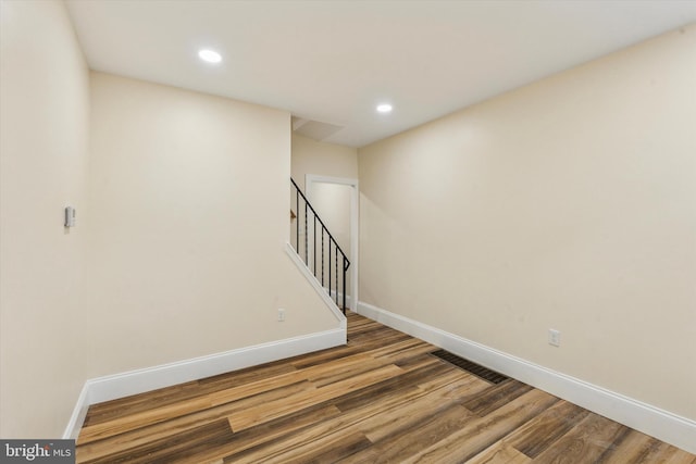 1611 N Cadwallader St, Philadelphia, PA 19122 - empty room with wood finished floors, baseboards, stairway, and recessed lighting