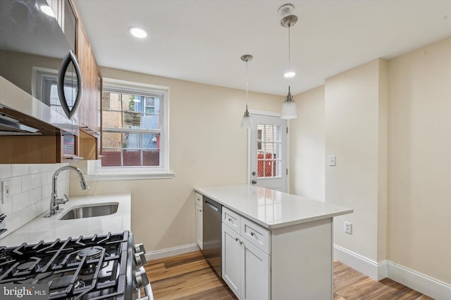 1611 N Cadwallader St, Philadelphia, PA 19122 - kitchen with a sink, stainless steel appliances, a peninsula, light wood finished floors, and recessed lighting