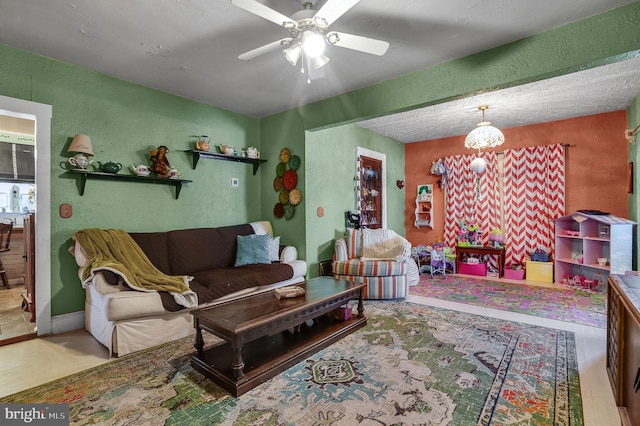 6126 Taylor St, Chincoteague Island, VA 23336 - living area with ceiling fan and a textured wall