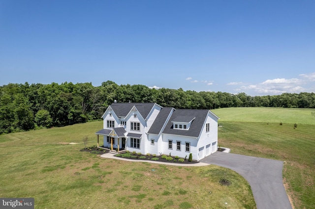 3471 Bullfrog Rd, Taneytown, MD 21787 - view of front facade with a porch, driveway, a front yard, and an attached garage