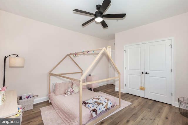 3471 Bullfrog Rd, Taneytown, MD 21787 - bedroom with baseboards, wood finished floors, a closet, and a ceiling fan