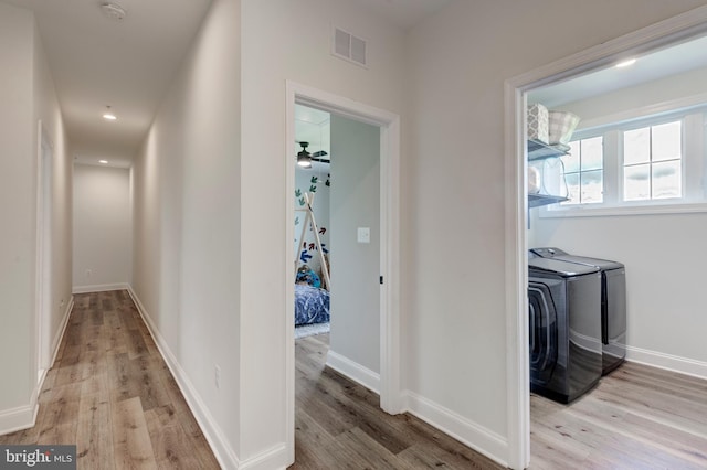 3471 Bullfrog Rd, Taneytown, MD 21787 - corridor with light wood-type flooring, baseboards, recessed lighting, and independent washer and dryer