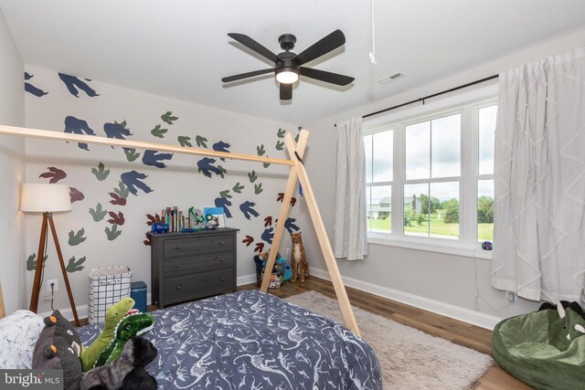 3471 Bullfrog Rd, Taneytown, MD 21787 - bedroom with baseboards, wood finished floors, and ceiling fan