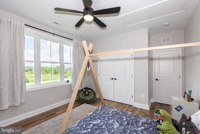 3471 Bullfrog Rd, Taneytown, MD 21787 - bedroom with attic access, wood finished floors, baseboards, ceiling fan, and a closet