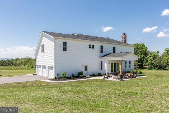 3471 Bullfrog Rd, Taneytown, MD 21787 - rear view of property with a garage, driveway, a yard, and a patio