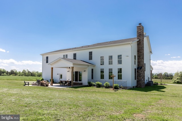 3471 Bullfrog Rd, Taneytown, MD 21787 - rear view of property featuring a chimney, a lawn, and a patio area