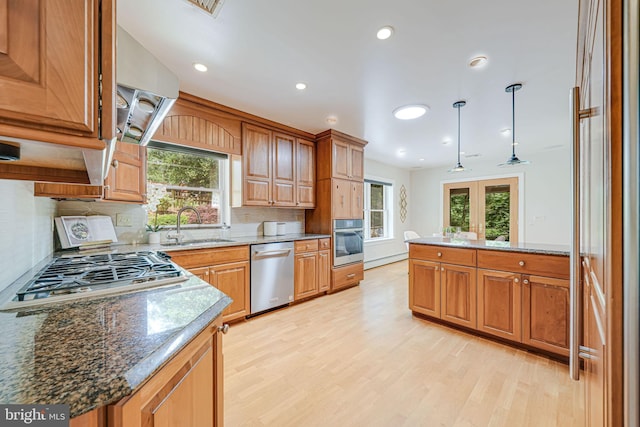 3404 Rustic Way Ln, Falls Church, VA 22044 - kitchen with appliances with stainless steel finishes, a sink, decorative backsplash, light wood-style floors, and recessed lighting