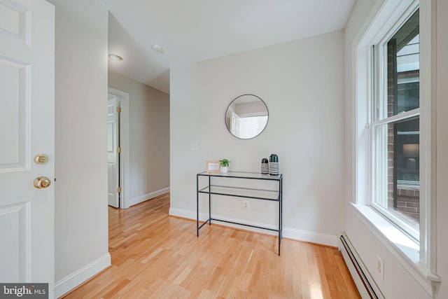 3404 Rustic Way Ln, Falls Church, VA 22044 - hallway featuring light wood-style floors, baseboards, and a baseboard heating unit