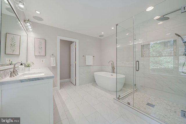 3404 Rustic Way Ln, Falls Church, VA 22044 - bathroom featuring a freestanding bath, a shower stall, double vanity, marble finish flooring, and recessed lighting
