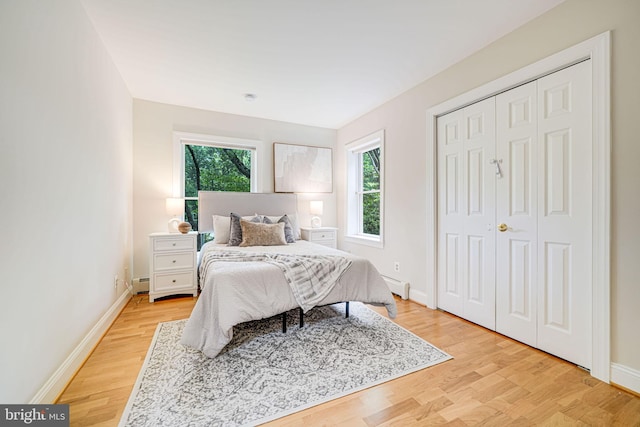 3404 Rustic Way Ln, Falls Church, VA 22044 - bedroom with a baseboard radiator, light wood-style flooring, and baseboards