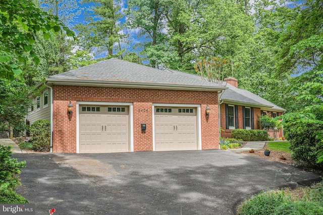 3404 Rustic Way Ln, Falls Church, VA 22044 - view of side of property with driveway, brick siding, a chimney, a garage, and roof with shingles